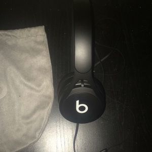 Beats black wired headphones